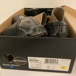 Size 9 M Nurse Mates gray and black paisley clogs. Never worn, still in box.